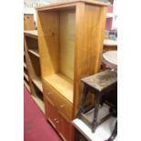 A modern pine bookshelf with lower cupboard doors, w.81cm