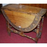 An early 20th century floral relief carved walnut gateleg occasional tableCondition report: Width
