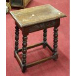 An 18th century style carved oak joint stool, width 42cm
