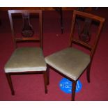 A pair of Edwardian mahogany and chequer strung salon chairs, each having a lyre shaped splat back