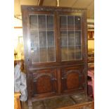 A moulded oak bookcase, w.106cm