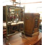 An Edwardian carved oak coal purdonium, w.32cm, together with a mirrored brass fire screen (2)