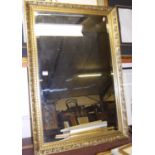 A reproduction gilt framed and bevelled wall mirror, 98 x 67cm