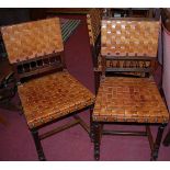 A set of six early 20th century oak and lattice work tan leather and further studded dining chairs