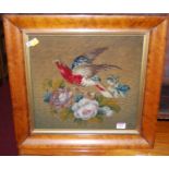 A Victorian woolwork panel, depicting bird and flowers, all housed in a birds-eye maple frame, gross