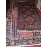 A Persian woollen blue ground rug, having all over geometric floral decorated ground, 250x 145cm,