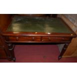 A Victorian mahogany round corner writing table, with green leather inset top and twin frieze