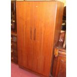 A 1970s G-Plan teak two door wardrobe, width 91cm