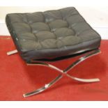 A Barcelona style stool, of typical chrome X-frame with black button backed leather seat, width