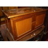 An oak twin panelled hinged top blanket box, width 90cm