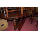 A Victorian style mahogany D-end extending dining table, the thumb-moulded top with wind-out