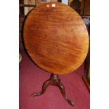 An early 19th century mahogany circular tilt-top pedestal tripod table, dia. 79cm