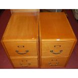 A pair of Art Deco light oak and plywood low two-drawer office filing chests, each w.45.5cm
