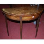 An early 19th century mahogany demi-lune fold-over card table, width 91.5cm