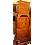 A yew wood television cabinet, w.61cm, together with two yew wood bedside chests (3)
