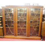 An early 20th century mahogany three door astragal glazed bookcase, width 152cmCondition report: