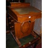 A Victorian marquetry inlaid walnut Davenport, with green leather inset writing surface, width 56cm