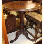 A Victorian mahogany and line carved circular pedestal fixed tripod occasional table, dia.58cm