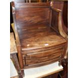 A 19th century Lancashire? mahogany commode, having a raised back above a hinged seat, w.55cm