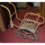 An early 20th century bamboo doll's cart