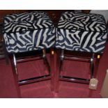 A pair of contemporary polished chrome framed and zebra effect upholstered bar stools, h.65cm