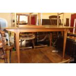 A 1960s McIntosh teak dining suite comprising; extending dining table with pull-out action and