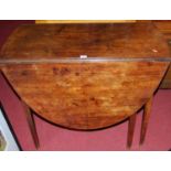 A 19th century mahogany drop leaf dining table