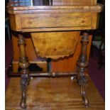 A mid-Victorian figured walnut, crossbanded and further satinwood strung fold-over games table,