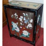 A contemporary Japanese black lacquered and further painted double door low side cupboard, width