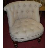A contemporary buttoned upholstered low tub nursing chair on turned forelegsCondition report: