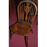 A set of four reproduction elm seated dining chairs, with crinoline stretchers