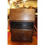 A 1930's oak bureau, w.55cm, together with a Edwardian oak coal purdonium (2)