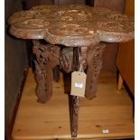 An Indian carved hardwood occasional table, dia.63cm