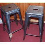 A pair of Tolex metal bar stools