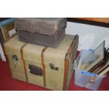 A wooden bound canvas trunk, w.82cm; and a canvas bound metal smaller trunk (2)