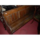 A late Victorian pitched pine panelled long church pew, width 192cm