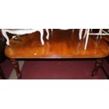 A mid-Victorian mahogany round cornered extending dining table, having wind-out action and single