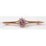 A 9ct gold, amethyst and white stone set bar brooch, 2.3g, 42mm