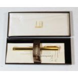 An Alfred Dunhill gilt metal cased fountain pen, having 14ct gold nib, in original box with