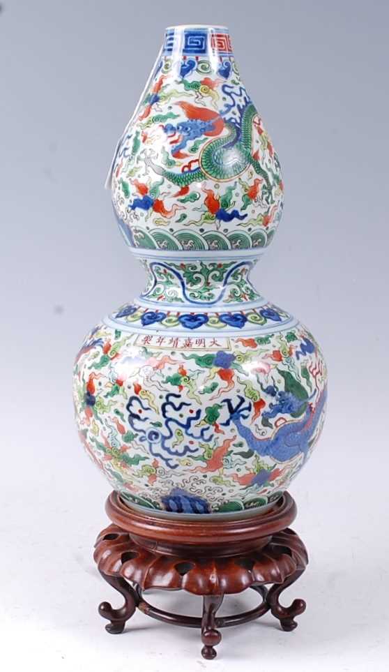 A Chinese export vase of double gourd form, enamel decorated with a Chinese five clawed dragon