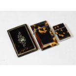 An early 20th century tortoiseshell, white metal and mother of pearl inlaid visiting card case,