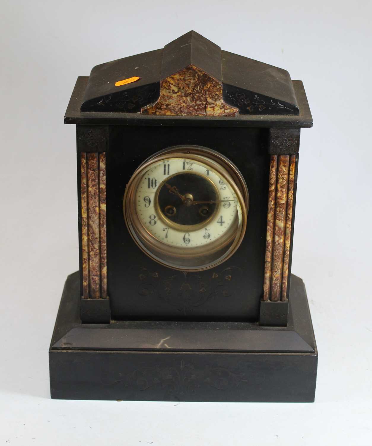 A Victorian black slate and rouge marble 8-day mantel clock, the dial with enamel chapter ring