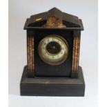 A Victorian black slate and rouge marble 8-day mantel clock, the dial with enamel chapter ring