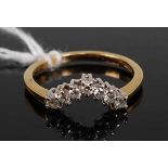 An 18ct gold diamond wishbone ring, set with seven-claw set brilliant, total diamond weight
