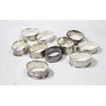 Ten various silver napkin rings, to include engine turned and engraved examples, all being of oval