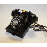 A black bakelite cased telephone