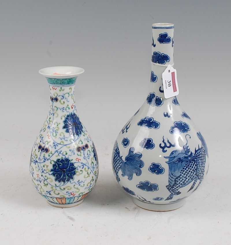 A Chinese export blue & white bottle vase of typical form decorated with mythical figures within