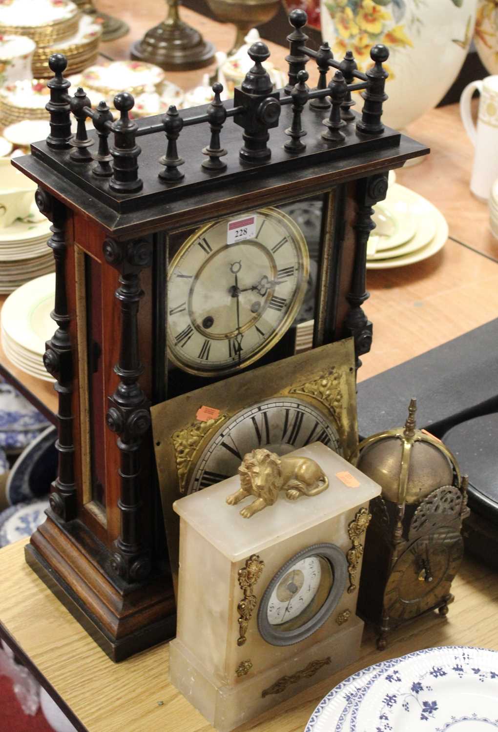 A late 19th century continental walnut and ebonised mantel clock, having enamelled dial with Roman