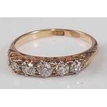 A late Victorian yellow metal diamond five-stone half hoop eternity ring, comprising five