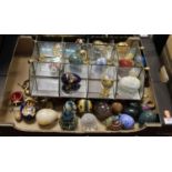 A box of ornamental, mostly glass and hardstone eggs, together with a mirrored sectional display